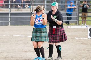 Photo by Douglass Fletcher Sisk##Gretchen Yoder, right, judges Kristine Rothwell in the caber competition at a Scottish Festival in Enumclaw, Washington, in 2019. Rothwell is one of the Titan athletes who will throw in McMinnville this year.
