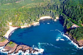 Image: Bryce Buchanan/ODOT##An aerial shot of Whale Cove shows the location of Bootlegger Rock and the beach on which the booze was buried.