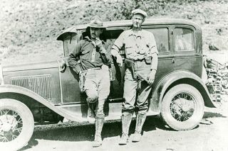 Image: UO Libraries##Luther Cressman (left) poses for a photograph with geologist Howard Stafford in front of Cressman’s Model A during fieldwork, most likely at the Catlow Valley cave site, in 1932.