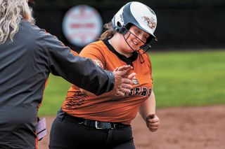 Rusty Rae/News-Register##YC s Cecelia Petraitis scored the winning run against St. Helens and hit two homers in the game.