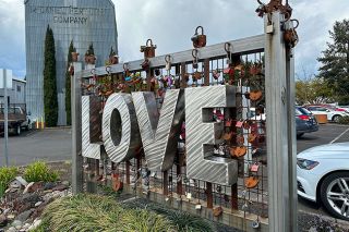 Kirby Neumann-Rea/News-Register ##“Love Locks” sculpture, loaded with personalized locks, stands in Granary Square off Alpine Avenue.