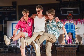 Rachel Thompson/News-Register##Brody Horne, Myles Ojua-Nice and Matthew Hansen of the boys dance team perform under the direction of math teacher Nate Ninteman.